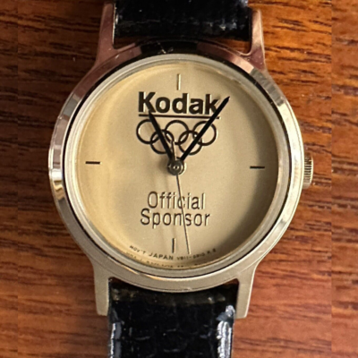 Ladies Kodak Olympics Official Sponsor Gold Tone Black Leather Bracelet Watch