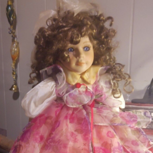 Porcelain Standing Doll With Curly Brown Hair