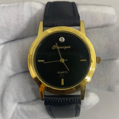 Classique Stainless Steel Back Golden Face Black Stripe Wristwatch